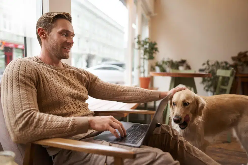 Dog accompanying his owner while he works